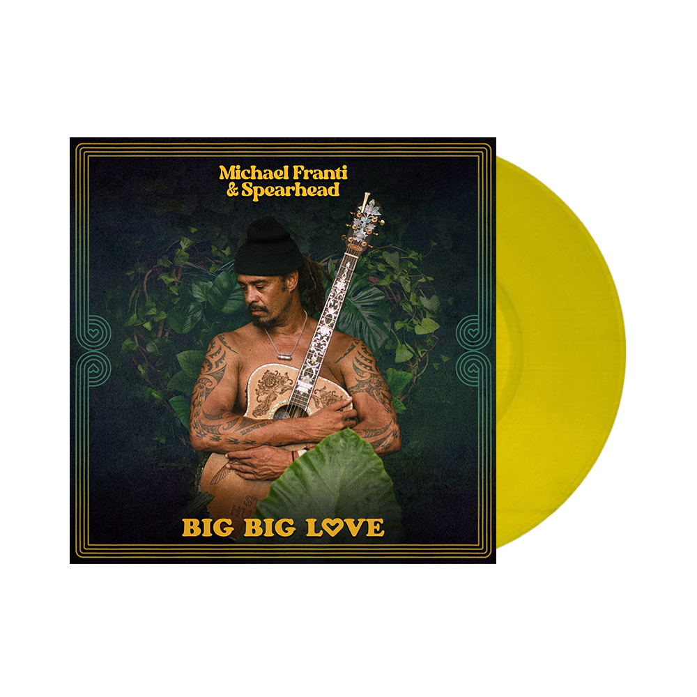 Album cover featuring a shirtless man holding a guitar, titled ’Big Big Love’ by Michael Franti & Spearhead.