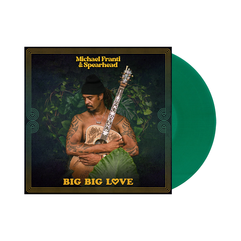 Album cover featuring a shirtless man with tattoos holding a guitar against a dark background with plants.