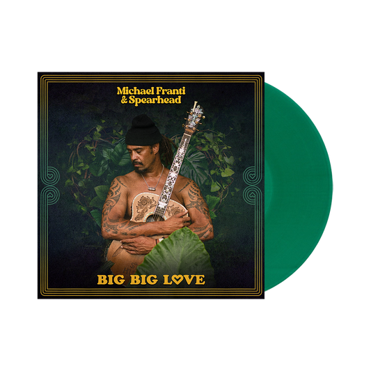 Album cover featuring a shirtless man with tattoos holding a guitar against a dark background with plants.