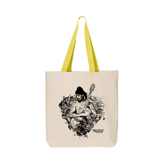 Canvas tote bag with yellow handles featuring a black and white artistic print of a musician playing guitar.