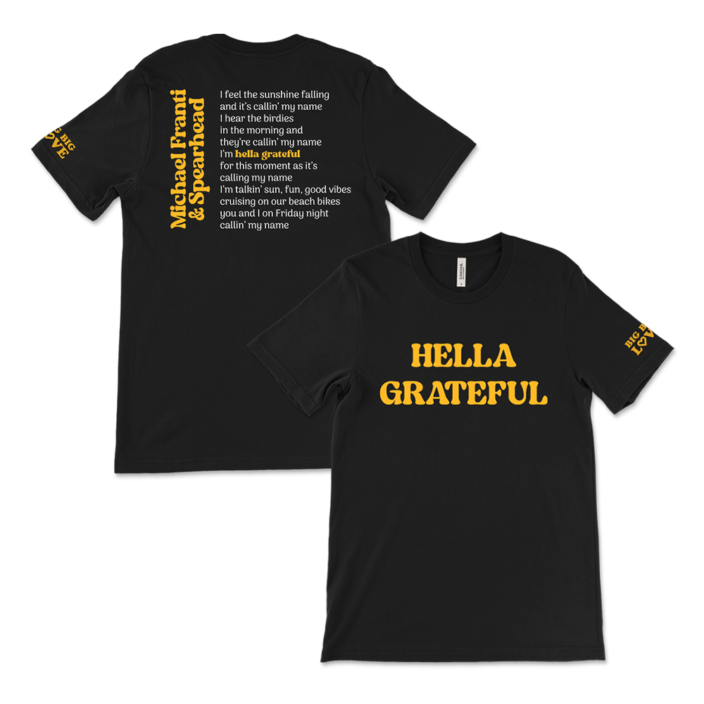 Black t-shirt with yellow text featuring lyrics and the phrase ’HELLA GRATEFUL’ on the front.