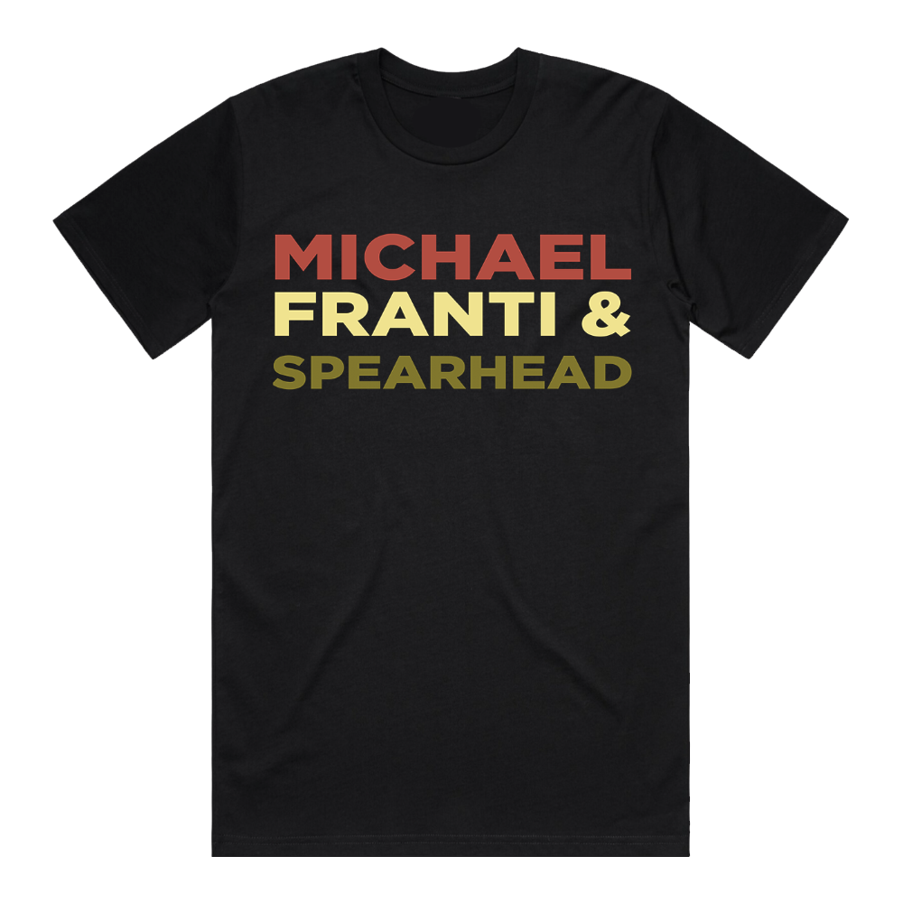 Black t-shirt with ’MICHAEL FRANTI & SPEARHEAD’ printed in red, yellow, and green text.