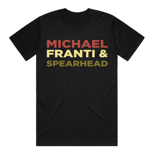 Black t-shirt with ’MICHAEL FRANTI & SPEARHEAD’ printed in red, yellow, and green text.