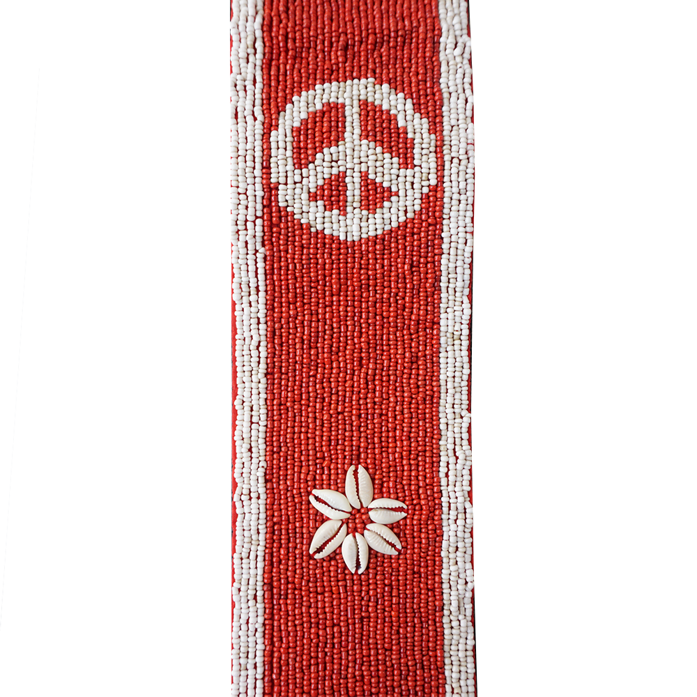 Beaded red fabric strip with white peace symbol and flower designs.