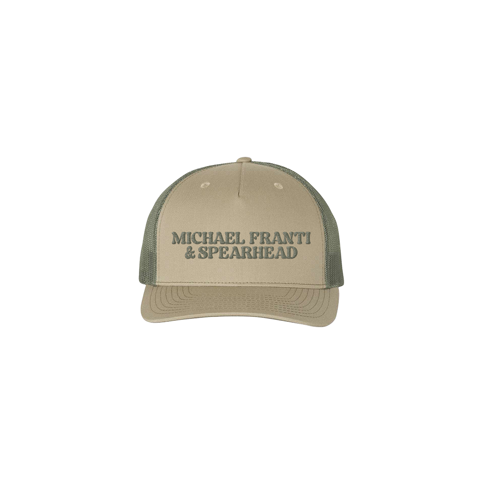 Tan and olive green trucker-style baseball cap with ’MICHAEL FRANTI & SPEARHEAD’ text.