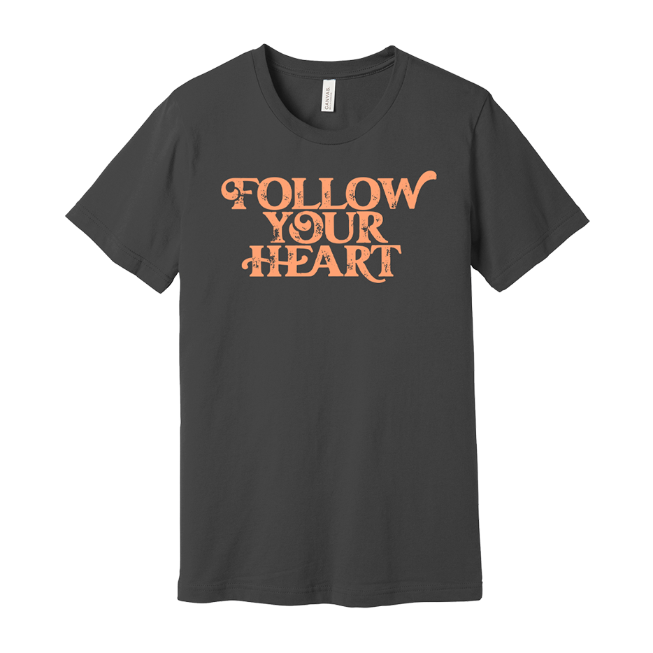 Dark gray t-shirt with ’FOLLOW YOUR HEART’ printed in orange lettering.